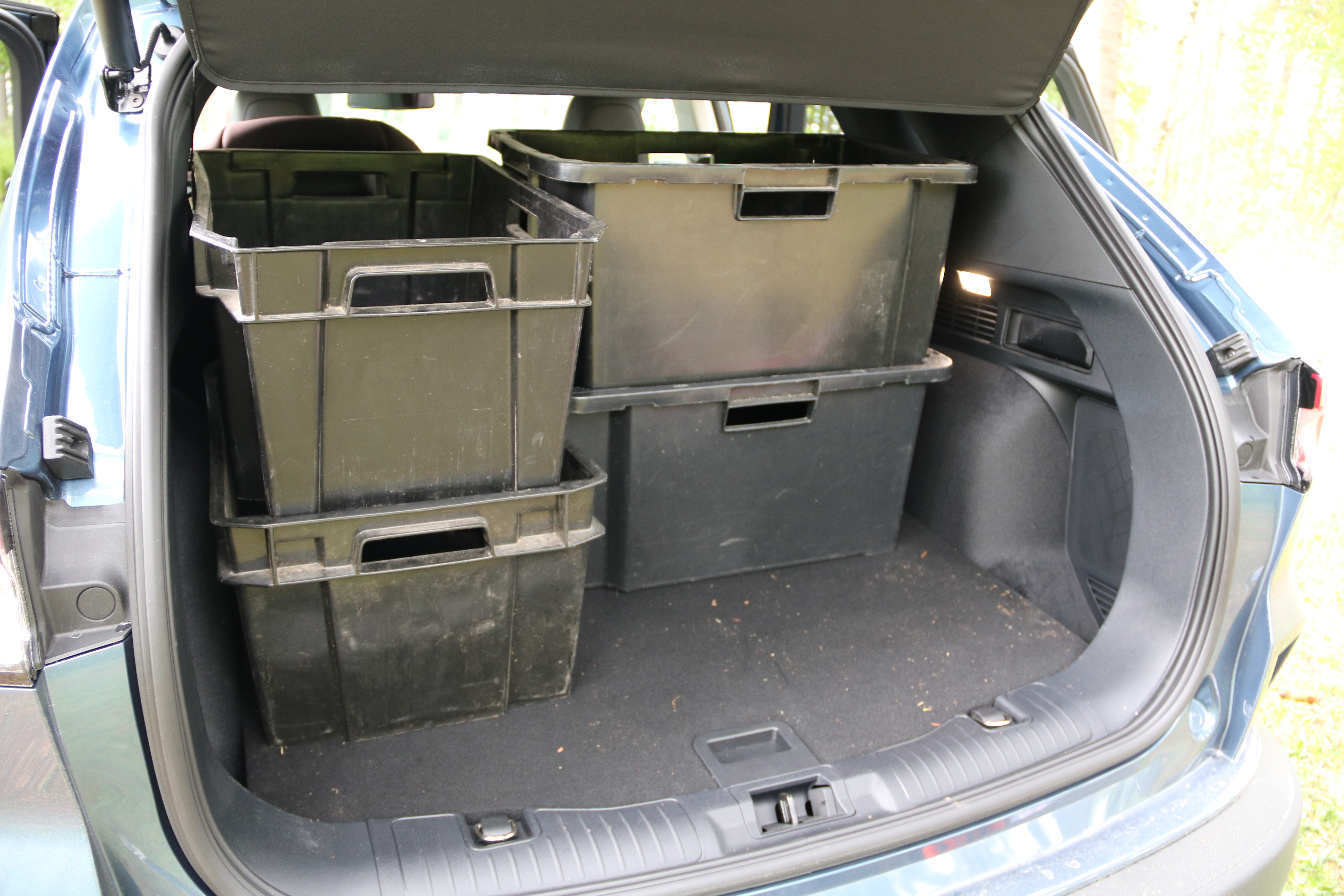 Ford Kuga PHEV trunk filled with four (five) plastic bins